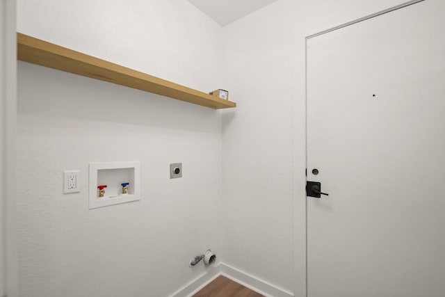 1417 Charolais Dr, Austin, TX 78758 - washroom featuring hookup for a washing machine, baseboards, dark wood-type flooring, and hookup for an electric dryer