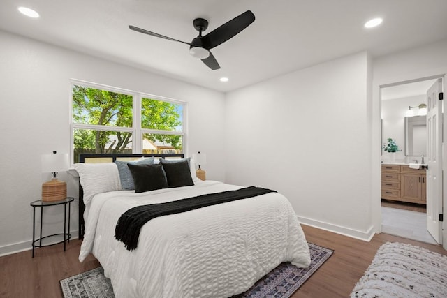 1417 Charolais Dr, Austin, TX 78758 - bedroom with light wood-style floors, a sink, baseboards, recessed lighting, and ensuite bathroom