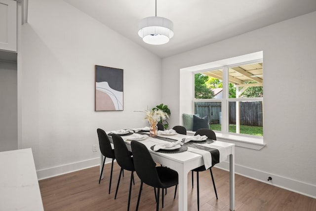 1417 Charolais Dr, Austin, TX 78758 - dining area featuring wood finished floors and vaulted ceiling