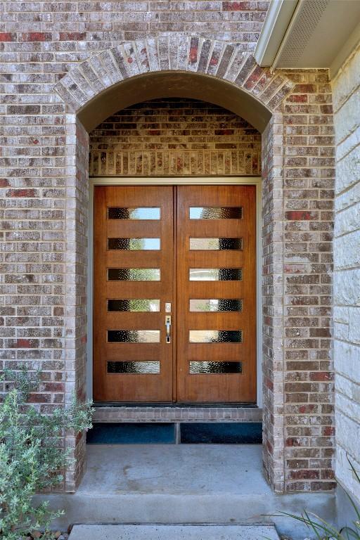 2032 Murano Ln, Leander, TX 78641 - doorway to property featuring brick siding