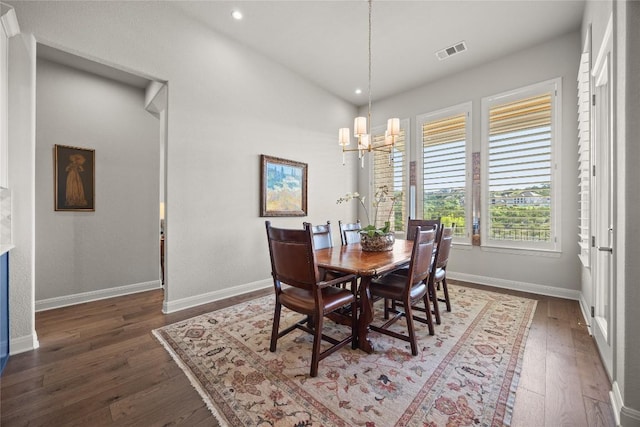 dining area featuring a chandelier, hardwood / wood-style flooring, baseboards, and recessed lighting
