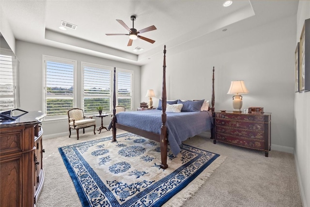 2032 Murano Ln, Leander, TX 78641 - bedroom with a tray ceiling, carpet, baseboards, and a ceiling fan