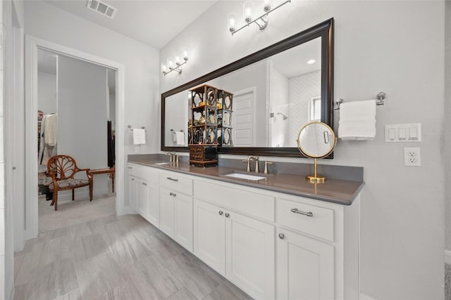 2032 Murano Ln, Leander, TX 78641 - bathroom featuring double vanity and baseboards
