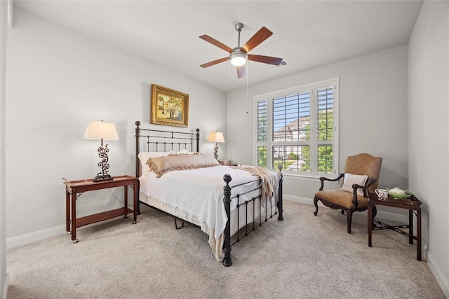 2032 Murano Ln, Leander, TX 78641 - bedroom with baseboards, light carpet, and a ceiling fan