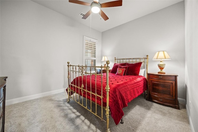 carpeted bedroom featuring baseboards and ceiling fan