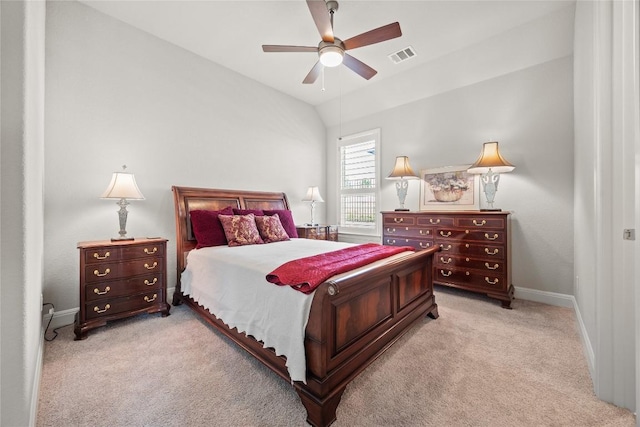 bedroom featuring light carpet, vaulted ceiling, baseboards, and a ceiling fan