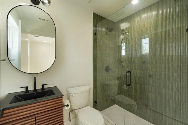full bathroom with a stall shower, toilet, and vanity