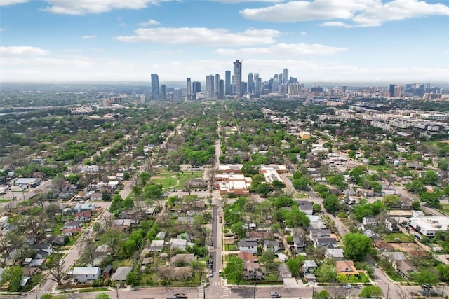 aerial overview of property's location featuring a view of skyline