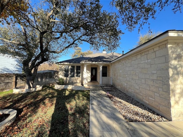 view of front of home with fence