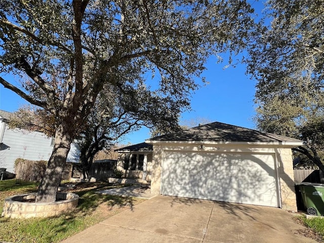 view of property exterior featuring a garage and driveway