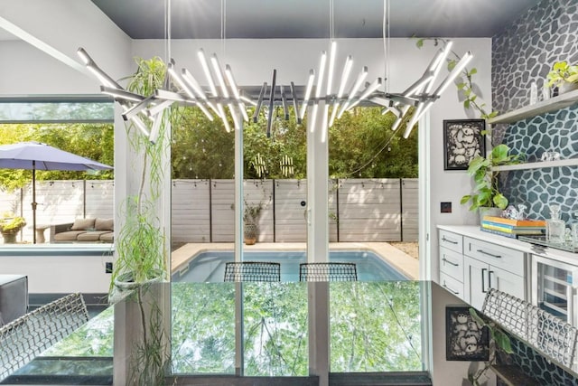 1111 Walton Ln Unit 2, Austin, TX 78721 - view of swimming pool featuring fence and an outdoor kitchen