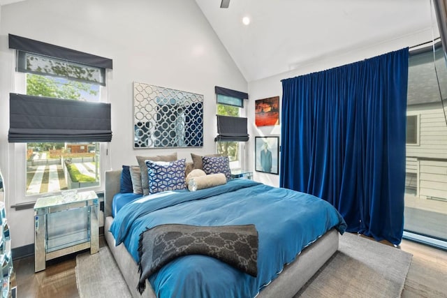 1111 Walton Ln Unit 2, Austin, TX 78721 - bedroom featuring wood finished floors, high vaulted ceiling, multiple windows, recessed lighting, and ceiling fan