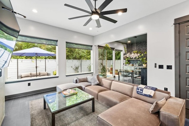 1111 Walton Ln Unit 2, Austin, TX 78721 - living area featuring ceiling fan, wood finished floors, recessed lighting, and baseboards