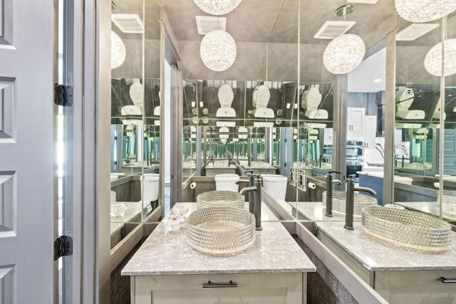 1111 Walton Ln Unit 2, Austin, TX 78721 - bathroom featuring a chandelier