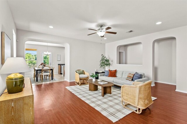 6212 Bumpstead Dr, Austin, TX 78747 - living area with wood finished floors, recessed lighting, arched walkways, ceiling fan, and baseboards