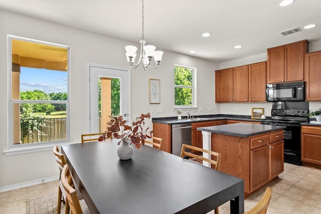 6212 Bumpstead Dr, Austin, TX 78747 - kitchen featuring black appliances, a sink, dark countertops, recessed lighting, and brown cabinetry