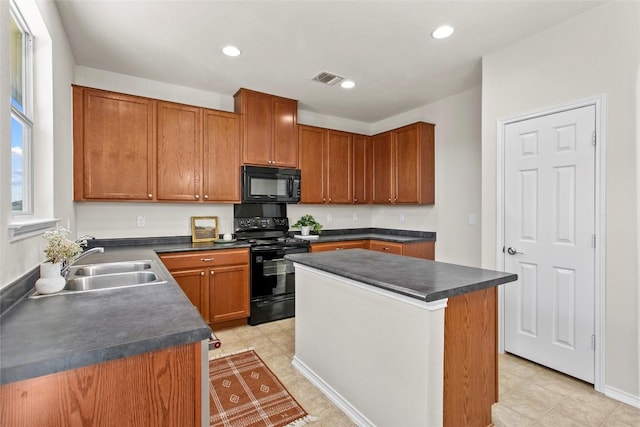 6212 Bumpstead Dr, Austin, TX 78747 - kitchen featuring black appliances, dark countertops, a sink, a kitchen island, and recessed lighting