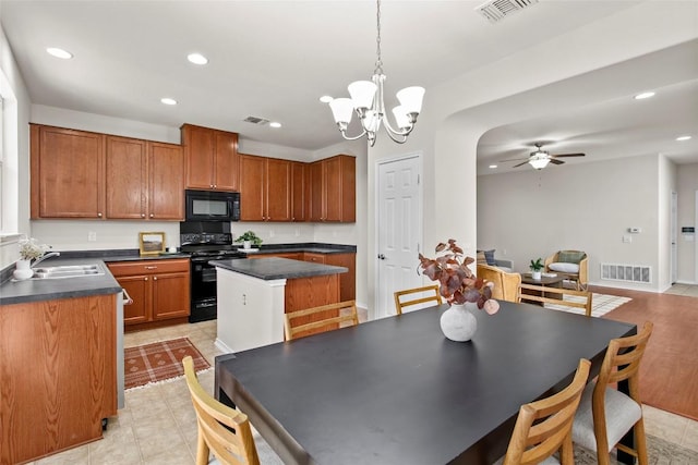 6212 Bumpstead Dr, Austin, TX 78747 - kitchen with black appliances, a sink, a ceiling fan, a kitchen island, and recessed lighting