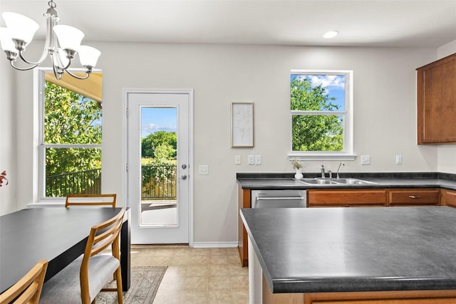 6212 Bumpstead Dr, Austin, TX 78747 - kitchen with dark countertops, a sink, a chandelier, stainless steel dishwasher, and brown cabinetry