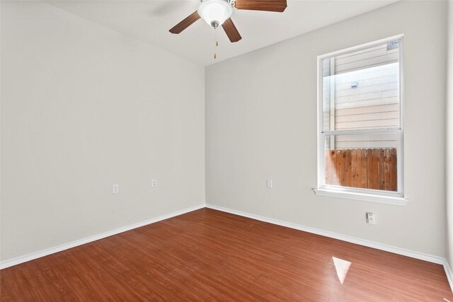 6212 Bumpstead Dr, Austin, TX 78747 - empty room featuring wood finished floors, a ceiling fan, and baseboards