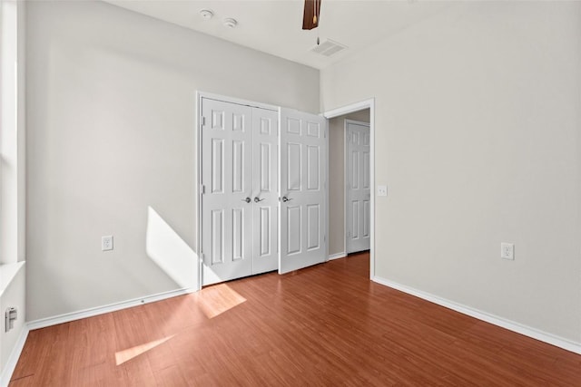 6212 Bumpstead Dr, Austin, TX 78747 - unfurnished bedroom featuring wood finished floors, baseboards, and a closet