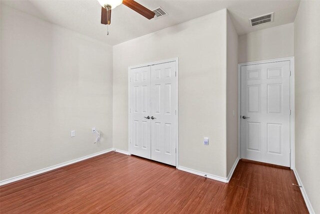 6212 Bumpstead Dr, Austin, TX 78747 - unfurnished bedroom with wood finished floors, a closet, baseboards, and ceiling fan
