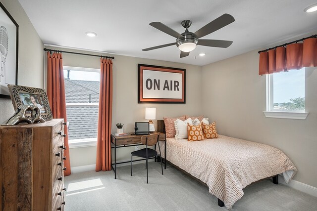 209 Golden Sage Ave, Georgetown, TX 78633 - bedroom featuring light carpet, baseboards, multiple windows, and recessed lighting