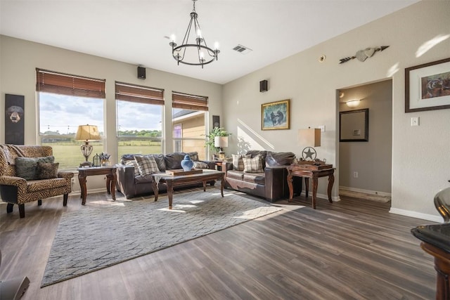 401 Southern Dr, Buda, TX 78610 - living area with dark wood finished floors, a chandelier, and baseboards