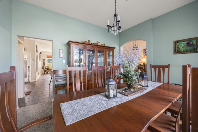 401 Southern Dr, Buda, TX 78610 - tiled dining area featuring a chandelier and baseboards