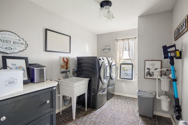 401 Southern Dr, Buda, TX 78610 - clothes washing area featuring separate washer and dryer, tile patterned floors, and baseboards