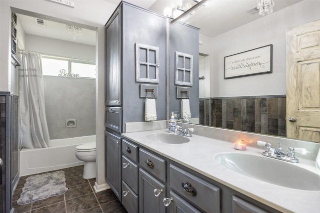 401 Southern Dr, Buda, TX 78610 - bathroom featuring toilet, double vanity, tile patterned floors, and shower / bathtub combination with curtain