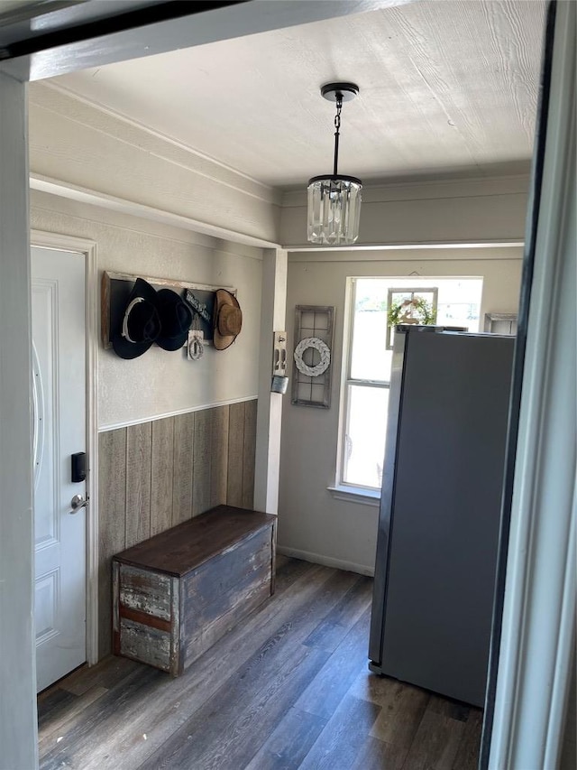 401 Southern Dr, Buda, TX 78610 - mudroom with a chandelier, wood finished floors, a wainscoted wall, and wooden walls