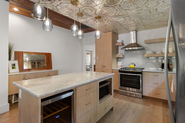 1307 E 2nd St, Austin, TX 78702 - kitchen featuring appliances with stainless steel finishes, wall chimney exhaust hood, light brown cabinetry, beverage cooler, and open shelves