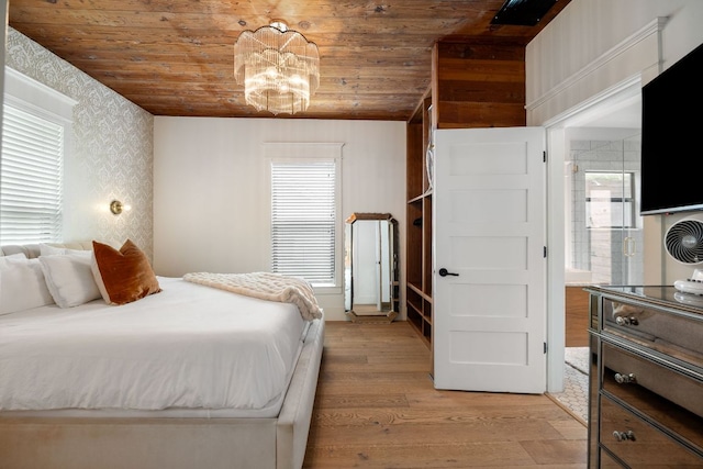 1307 E 2nd St, Austin, TX 78702 - bedroom with wood ceiling, light wood-type flooring, multiple windows, wallpapered walls, and a chandelier