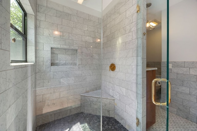 1307 E 2nd St, Austin, TX 78702 - bathroom featuring a stall shower, tile walls, and vanity