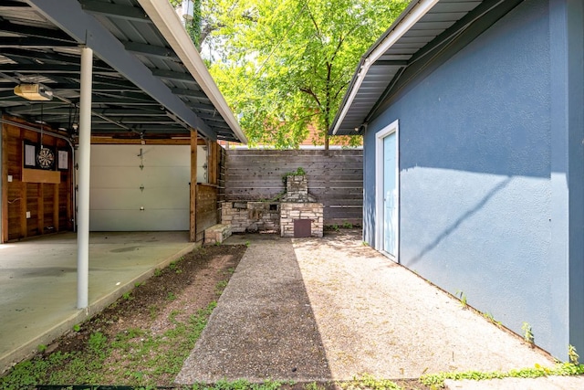 1307 E 2nd St, Austin, TX 78702 - view of property exterior with stucco siding and fence