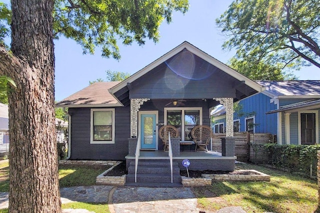 1307 E 2nd St, Austin, TX 78702 - bungalow featuring a porch and fence