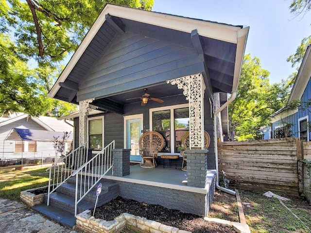 1307 E 2nd St, Austin, TX 78702 - view of front of home featuring ceiling fan, fence, and a porch