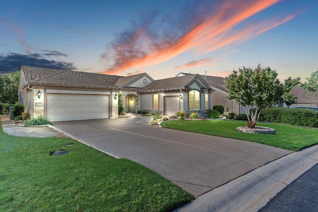 307 Palmetto Dr, Georgetown, TX 78633 - ranch-style house with an attached garage, driveway, a yard, and stucco siding