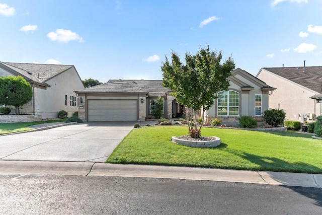 307 Palmetto Dr, Georgetown, TX 78633 - view of front of property featuring a garage, driveway, a front yard, and stucco siding
