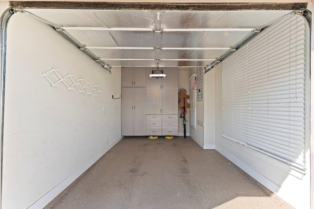 307 Palmetto Dr, Georgetown, TX 78633 - garage featuring baseboards and a garage door opener
