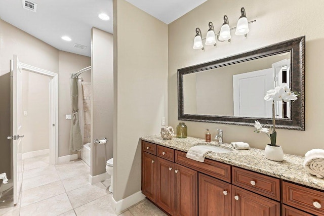 307 Palmetto Dr, Georgetown, TX 78633 - full bath featuring toilet, vanity, tile patterned floors, shower / bath combination with curtain, and baseboards