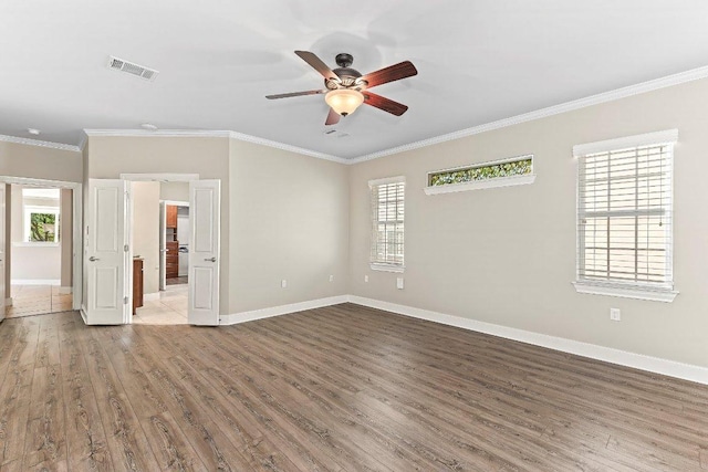 307 Palmetto Dr, Georgetown, TX 78633 - unfurnished room featuring wood finished floors, a ceiling fan, crown molding, and baseboards