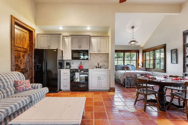 164 Camino Del Reserve, Comfort, TX 78013 - kitchen featuring black appliances, light tile patterned floors, decorative backsplash, light countertops, and open floor plan