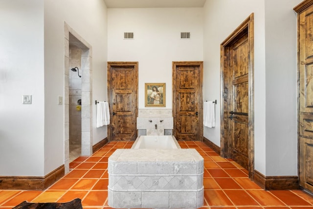 164 Camino Del Reserve, Comfort, TX 78013 - hallway featuring baseboards, tile patterned flooring, and a high ceiling