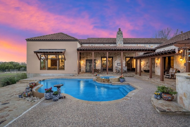 164 Camino Del Reserve, Comfort, TX 78013 - pool at dusk with a patio area and a pool with connected hot tub