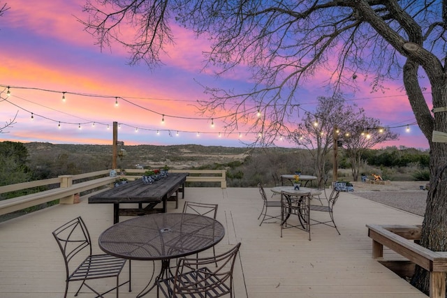 164 Camino Del Reserve, Comfort, TX 78013 - patio terrace at dusk with outdoor dining space and a deck