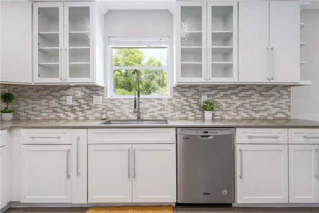 kitchen featuring dishwasher, a sink, open shelves, white cabinets, and tasteful backsplash
