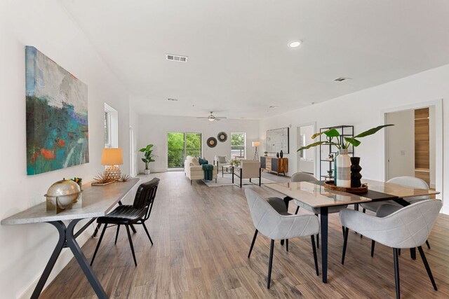 6444 Burnet Rd Unit 204, Austin, TX 78757 - dining room with wood finished floors, ceiling fan, and recessed lighting