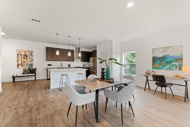 6444 Burnet Rd Unit 204, Austin, TX 78757 - dining room featuring light wood-style flooring and recessed lighting